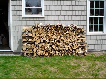 Storing firewood next online to house