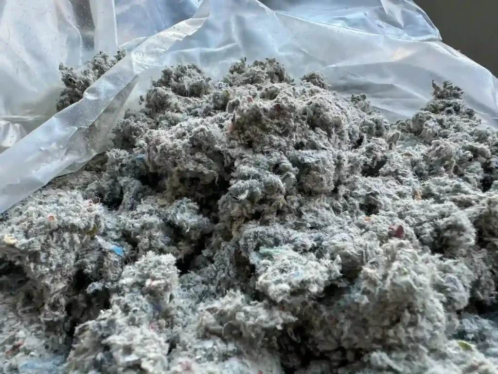 Cluster of cellulose attic insulation
