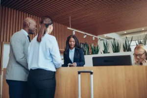 Hotel guests checking in at the front desk not worried about spotting a rodent during their stay.